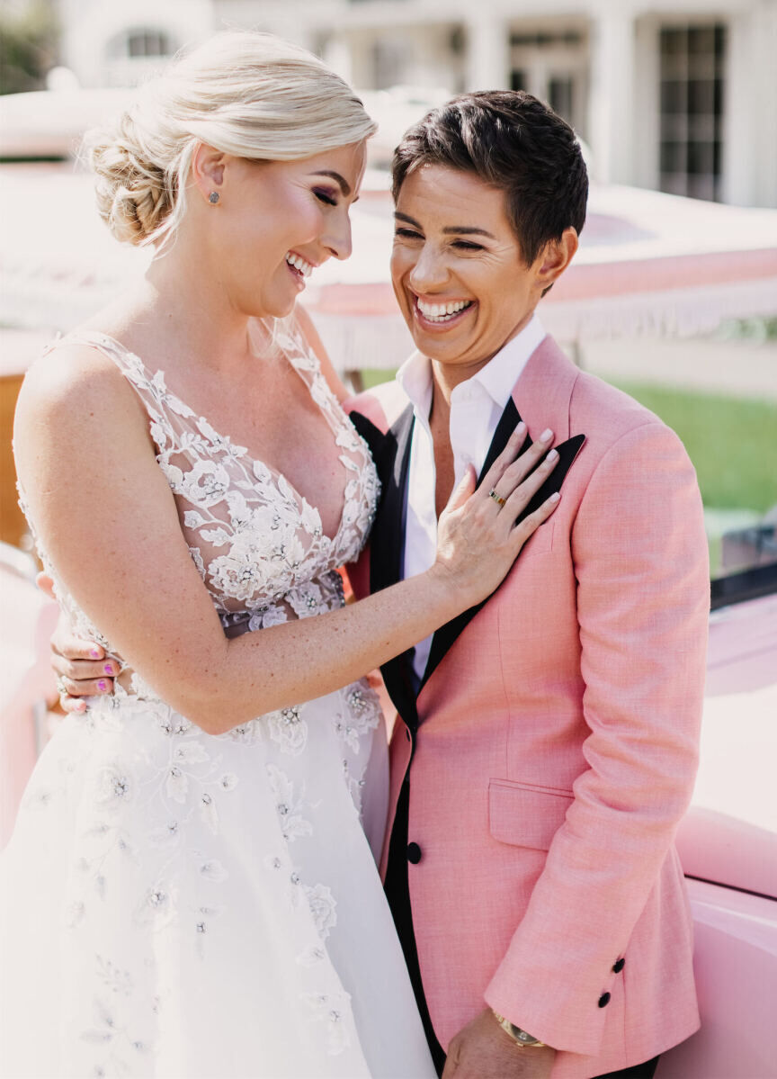 Wedding Tips: Two newlyweds holding each other and grinning.
