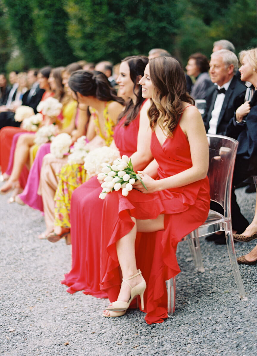 Wedding Tips: Bridesmaids and guests sitting and watching a wedding ceremony.